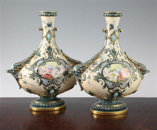 A pair of Royal Worcester blush ivory pilgrim bottle shaped vases, 26.5cm